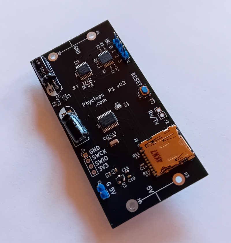 Assembled board with capacitors and pin headers