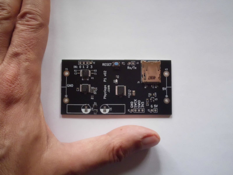 Unassembled board with hand for size comparison